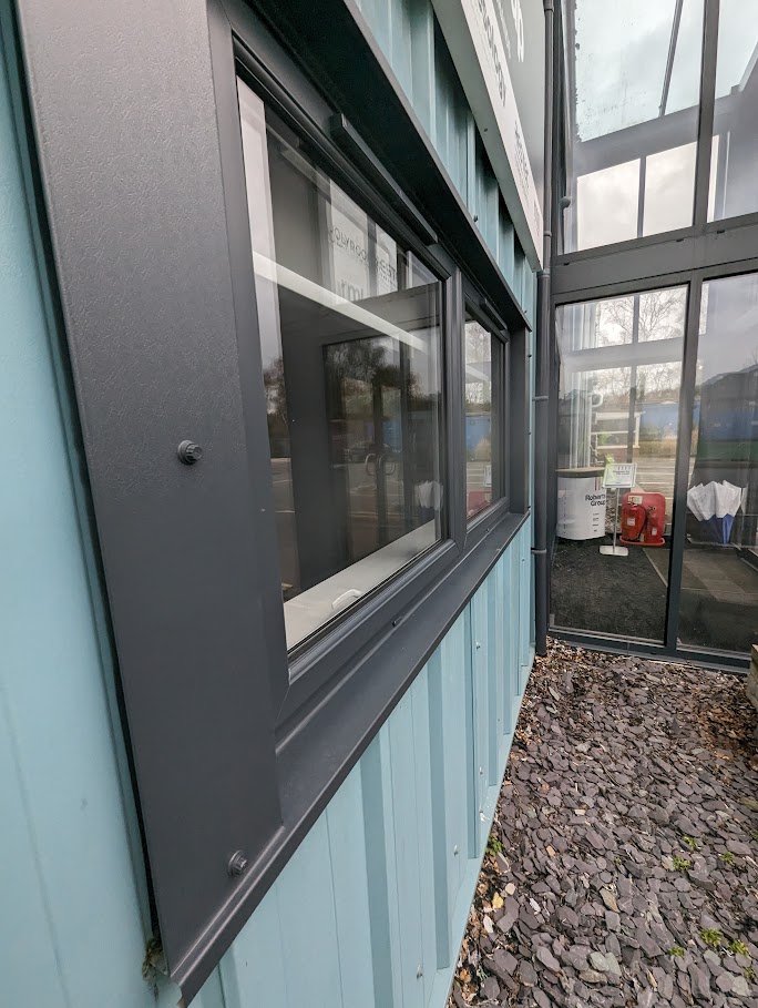 Close up of window that has been sprayed on a commercial building